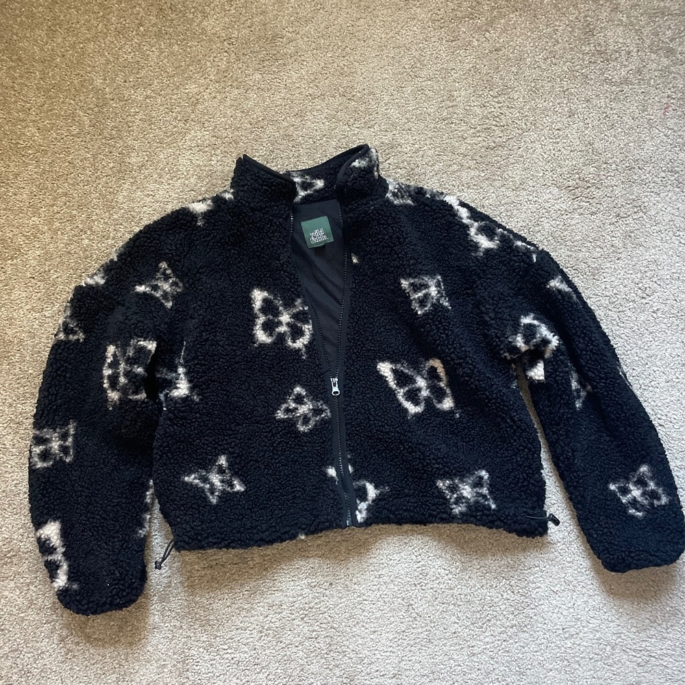 Fleece jacket with butterflies.